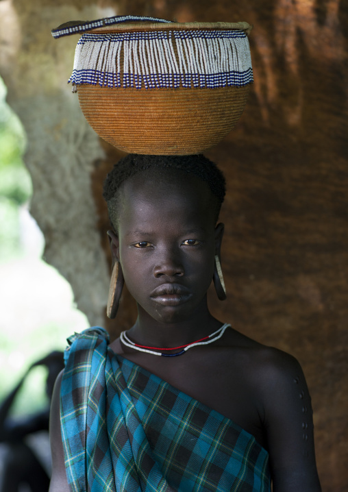 Mursi Tribe Woman With Basket On Her Head Chaidu, Omo Valley, Ethiopia
