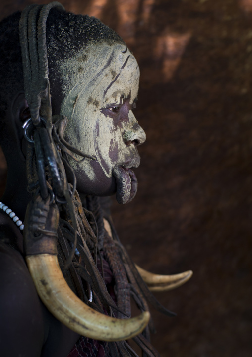 Mursi Tribe Woman With Enlarged Lip, Face Paintings And Wearing Warthog Teeth, Chaidu, Omo Valley, Ethiopia