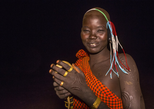 Bodi Tribe Young Woman With Her Mobile Phone On Her Head, Hana Mursi, Omo Valley, Ethiopia