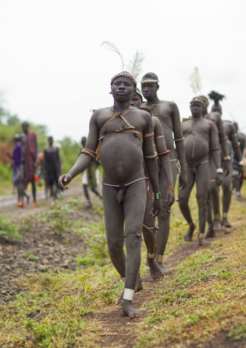 Bodi Tribe Fat Men Going To The Kael Ceremony, Hana Mursi, Omo Valley, Ethiopia