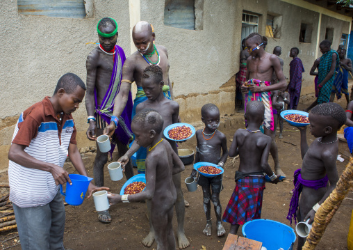 Mursi Tribe Kids Having Food In Their School, Mago Park, Omo Valley, Ethiopia