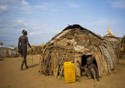 Dassanech Tribe Boy Standing In Front Of His House, Omorate, Omo Valley, Ethiopia