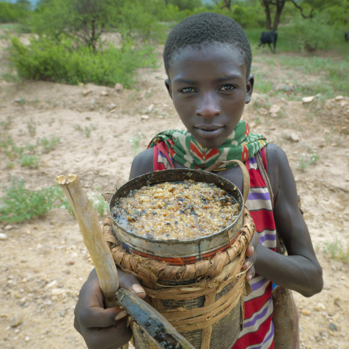 Little Boy Holding Can Of Honey In Hands Ethiopia