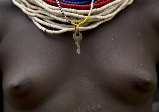 Naked Breasts Of Karo Woman With Beaded Necklaces And Key Pendant Ethiopia