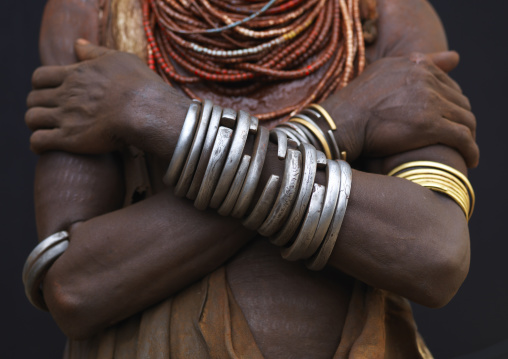 Detail Of Karo Woman Chest Wearing Metal Bracelets And Beaded Necklaces, Crossed Arms Omo Valley Ethiopia