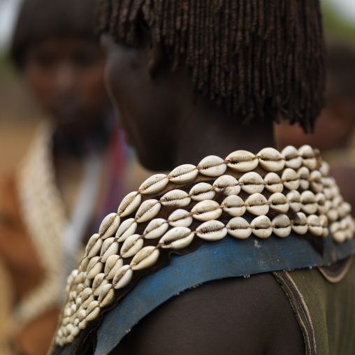 Back of a tsemay tribe woman wearing shell belt around her neck, Omo valley, Ethiopia