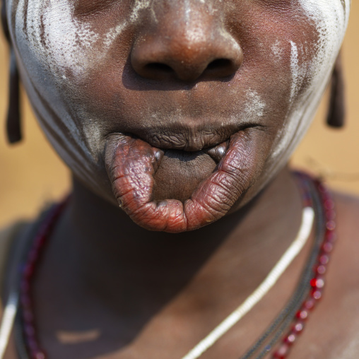 Detail Of Extended Lip Mursi Woman Face Ethiopia