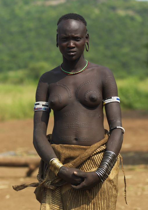 Standing Topless Mursi Woman Head And Shoulders Ethiopia