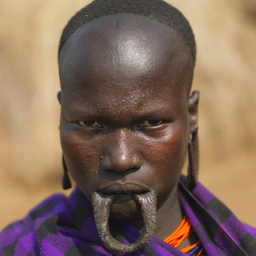 Portrait Of Traditionally Dressed Mursi Woman With Expanded Inferior Lip Ethiopia