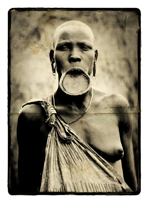 Sepia Portrait Of A Mursi Tribe Woman With Lip Plate And Enlarged Ears In Mago National Park, Omo Valley, Ethiopia