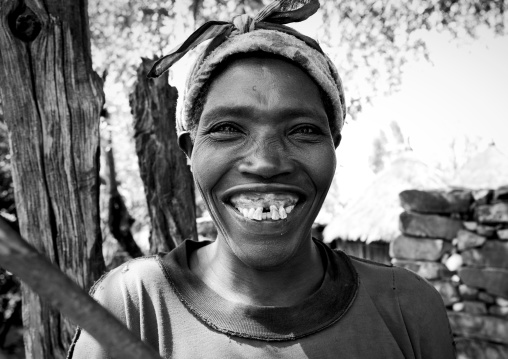 Black And White Portrait Of A Konso Tribe Woman With Wide Toothy Smile, Konso, Omo Valley, Ethiopia