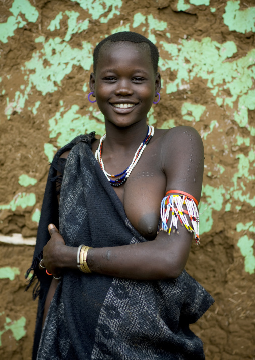 Portrait Of Miss Bichoni, Young Bodi Tribe Woman With Toothy Smile, Hana Mursi, Omo Valley, Ethiopia