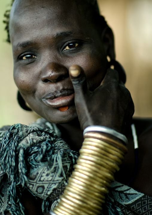 Portrait Of A Smiling Bodi Tribe Woman With Copper Bracelets, Hana Mursi, Omo Valley, Ethiopia