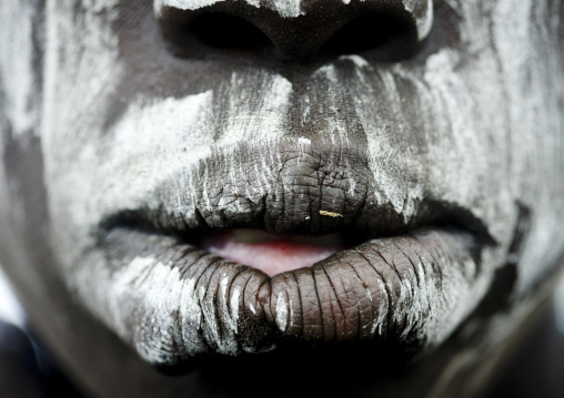 Close Up On A Mursi Tribe Woman Mouth With Face Paint In Mago National Park, Omo Valley, Ethiopia