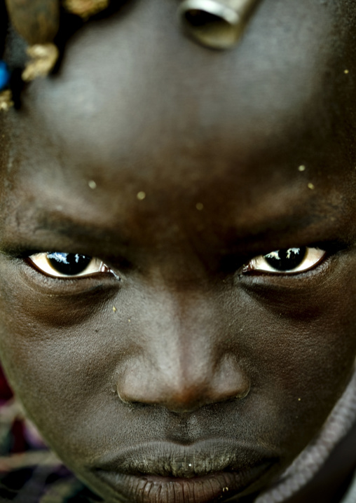 Close Up Portrait Of A Mursi Tribe Kid Face In Mago National Park, Omo Valley, Ethiopia