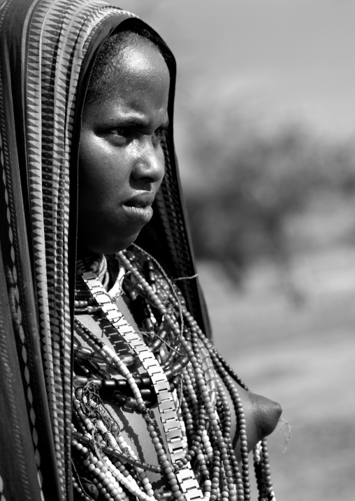 Arbore Tribe Tennage Girl With Naked Breast And Beaded Necklace, Omo Valley, Ethiopia