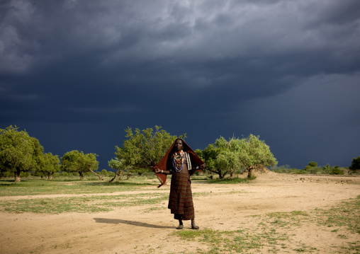 Erbore Tribe Woman Under A Stormy Sky, Weito, Omo Valley, Ethiopia