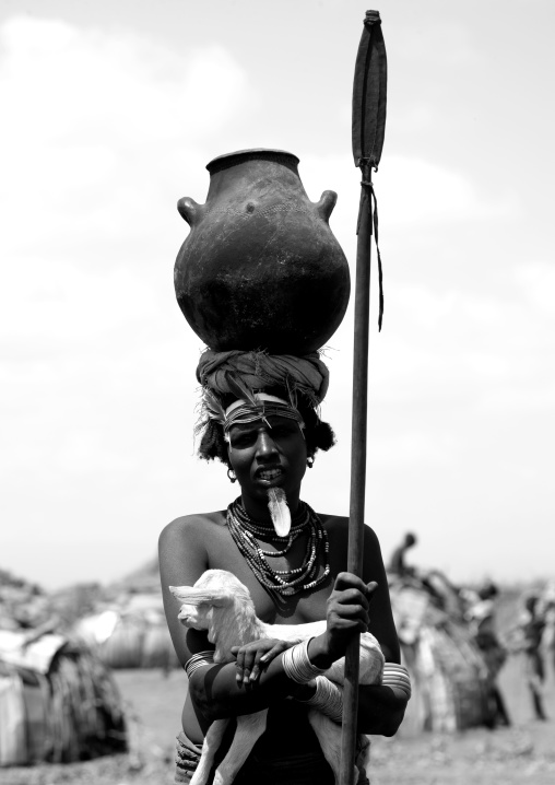 Black And White Portrait Of A Dassanech Tribe Woman Carrying A Pot On Her Head, Omorate, Omo Valley, Ethiopia