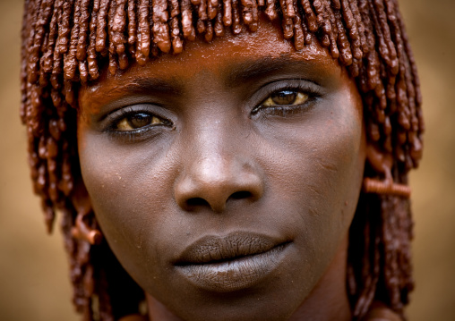 Close-up Portrait Of Hamar Tribe Woman With Traditional Stranded Hair Tied With Clay, Turmi, Omo Valley, Ethiopia