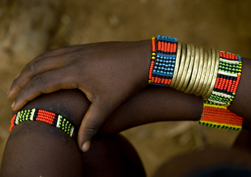 Close Up On The Golden And Colourful Bracelets Of A Hamar Tribe Woman, Omo Valley, Ethiopia
