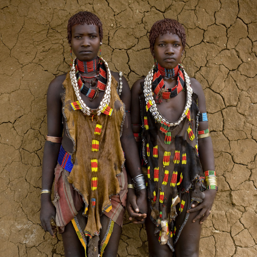 Portrait Of Two Hamar Tribe Women Posing With Traditional Necklace And Animal Skin-made Clothes, Turmi, Omo Valley, Ethiopia