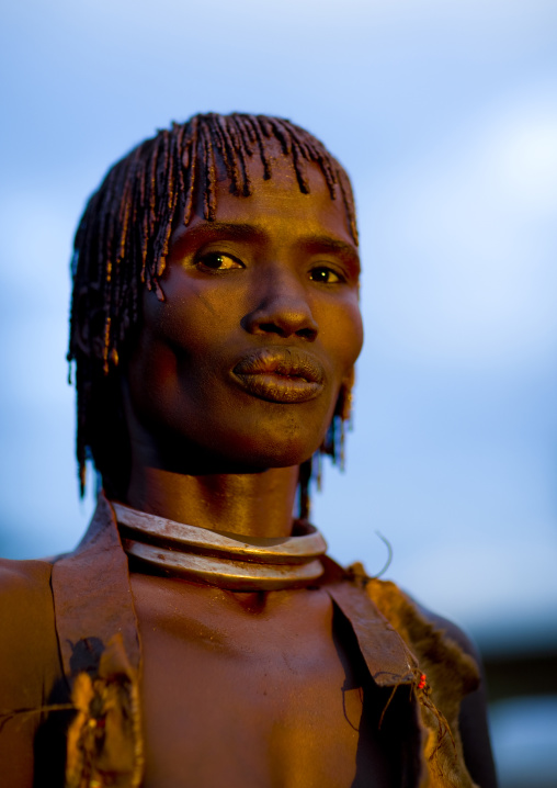 Portrait Of A Proud Hamar Tribe Woman With Iron Necklaces And Stranded Hair At Sunset, Turmi, Omo Valley, Ethiopia