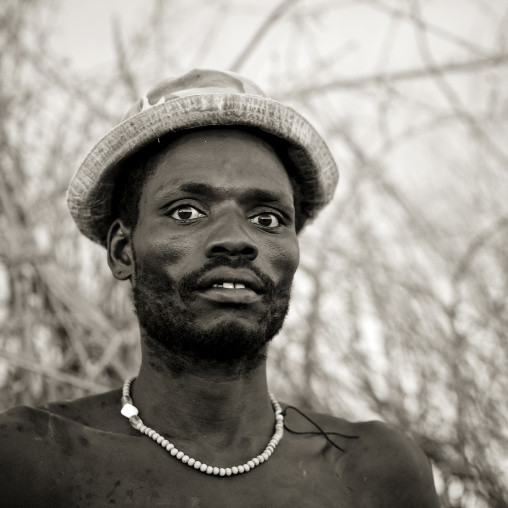 Portrait Of Nyangatom Tribe Man Wearing A Hat And A Necklace, Omo Valley, Ethiopia