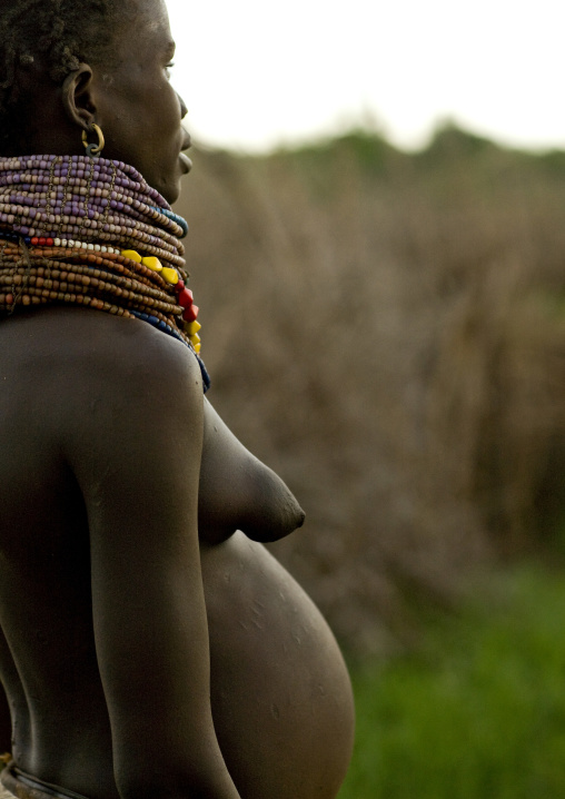 Pregnant Nyangatom Tribe Woman With Necklaces, Omo Valley, Ethiopia