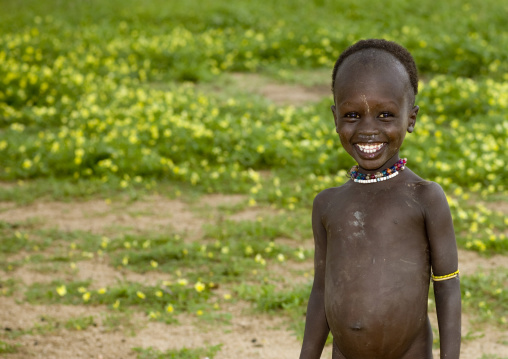 Portrait Of A Kid From Karo Tribe With Toothy Smile, Korcho Village, Omo Valley, Ethiopia