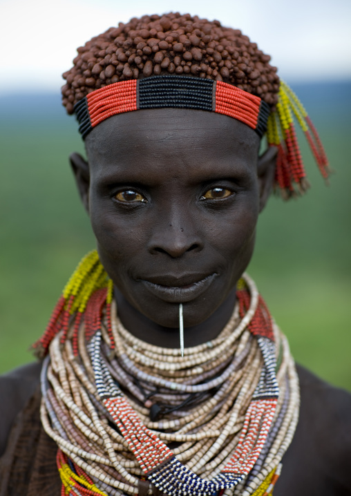 Portrait Of A Karo Tribe Woman With Coffee Bean Hairstyle, Wearing Traditional Necklaces And Headband, Korcho Village, Omo Valley, Ethiopia