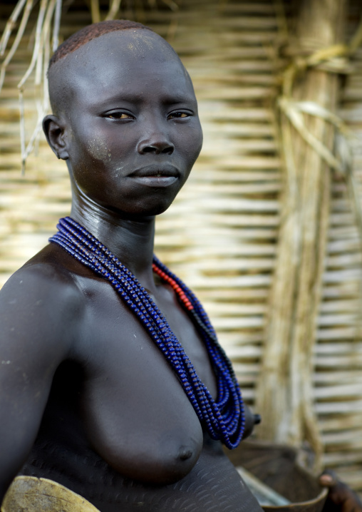 Portrait Of A Young Karo Tribe Woman With Necklace Outside A Hut, Korcho Village, Ethiopia
