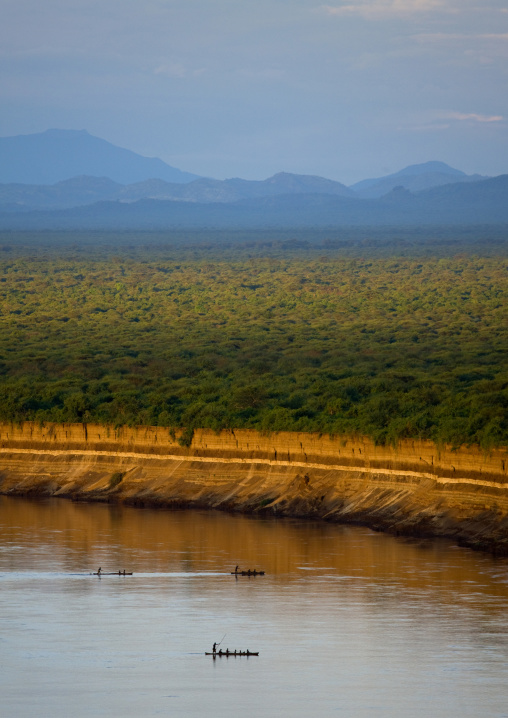 Boats Crossing Omo River With Mountains In The Background, Omo Valley, Ethiopia