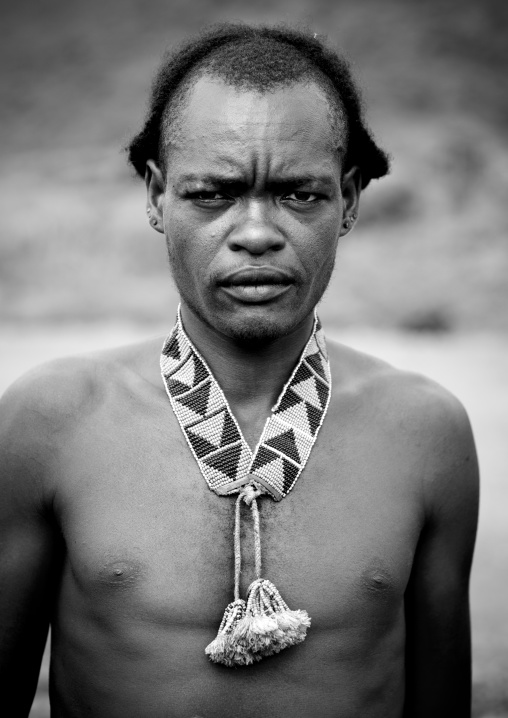 Portrait of a tsemay tribe man wearing beaded jewels, Omo valley, Ethiopia