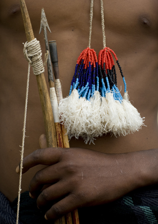 Arrow and bow in hand of a tsemay tribe man, Omo valley, Ethiopia