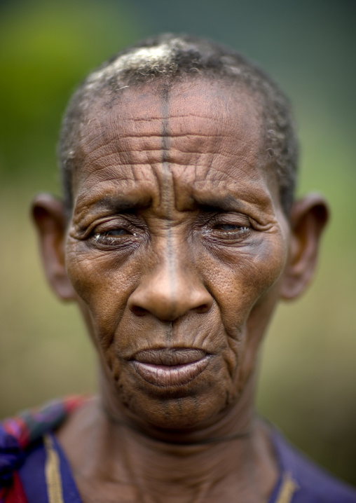Portrait of an old tatooed ari tribe woman, Jinka, Ethiopia