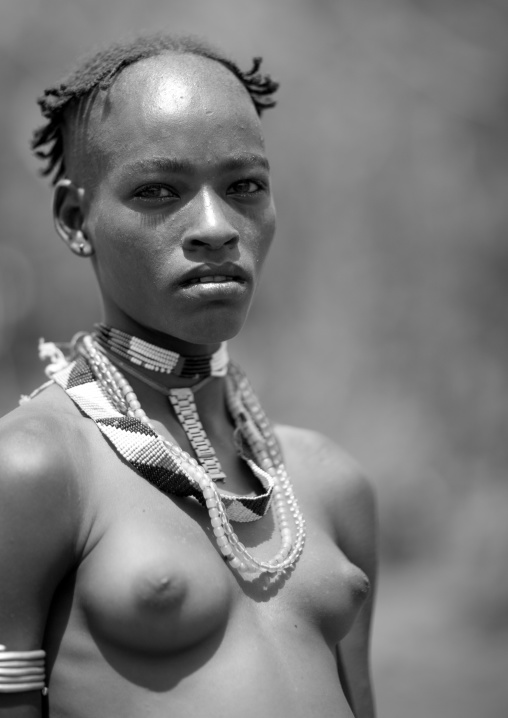 Portrait of ari topless  young woman omo valley Ethiopia