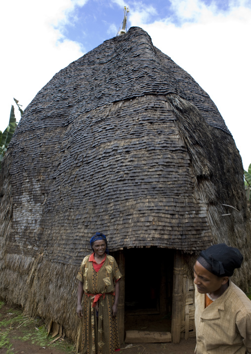 Women standing outside a dorze traditionnal house, Chencha, Ethiopia