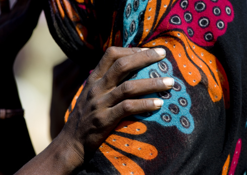 Woman putting her hand on a shoulder of a friend, Assaita, Afar regional state, Ethiopia