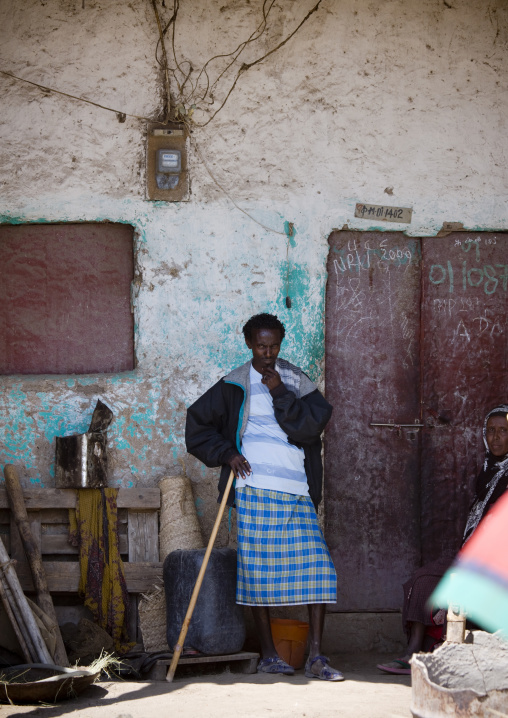 Man standing under shadow, Assaita, Afar regional state, Ethiopia
