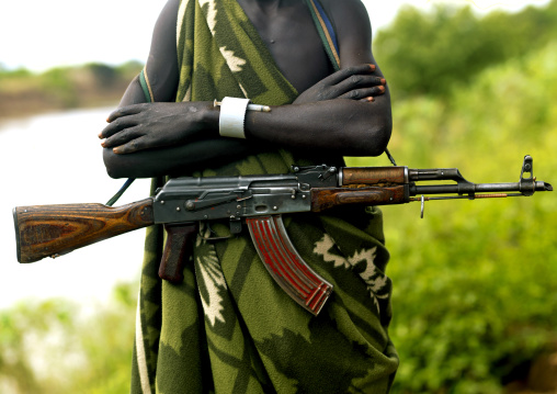 Kalashnikov On The Hip Of A Mursi Tribe Man In Mago National Park, Omo Valley, Ethiopia