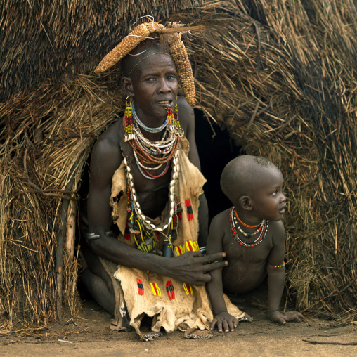 Portrait Of A Karo Tribe Mother And Kid At The Entrance Of Their Hut, Korcho Village, Ethiopia