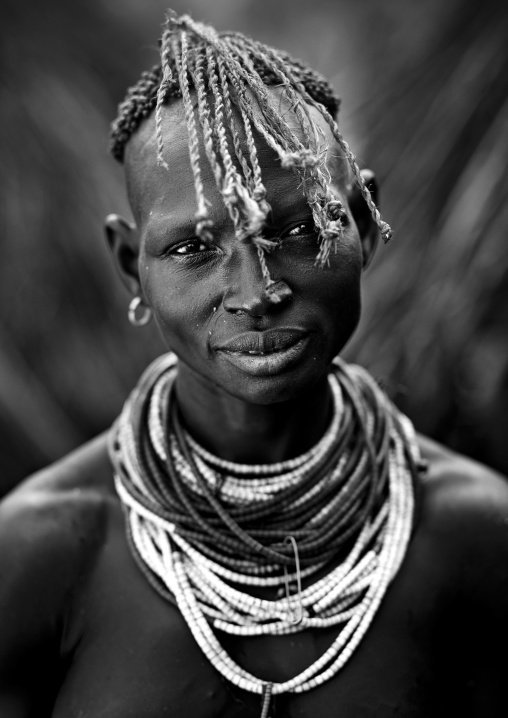 Black And White Portrait Of A Karo Tribe Woman With Traditional Necklace And Hairstyle, Korcho Village, Ethiopia