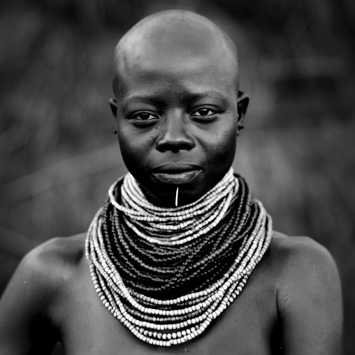 Portrait Of Young Karo Woman With Beaded Jewels And Shaved Head Omo Valley Ethiopia