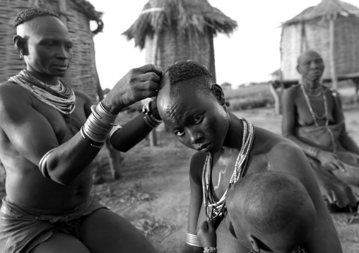 Black And White Picture Of A Karo Tribe Woman Receiving A Haircut, Korcho Village, Omo Valley, Ethiopia