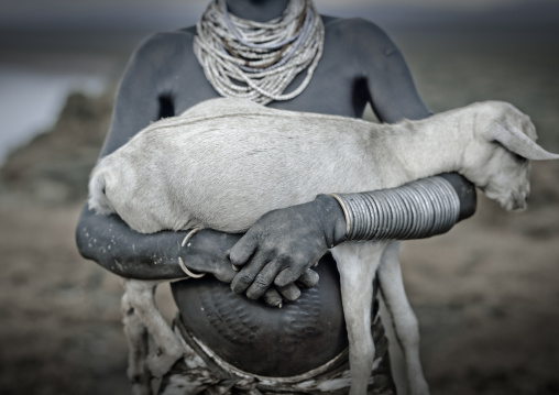 Scarified Body Karo Woman Holding A Baby Goat In Arms Ethiopia