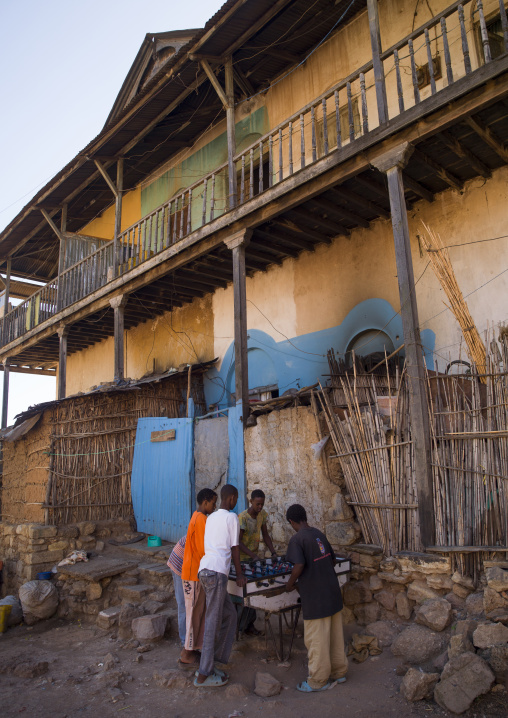 Kids Playing Baby Foot In Front Of An Old House, Harar, Ethiopia