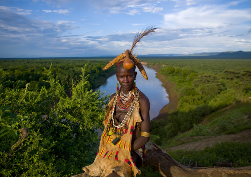 Senior Karo Woman With Headdress Made Of Corn Cob And Calabash Posing Above The River Omo Valley Ethiopia