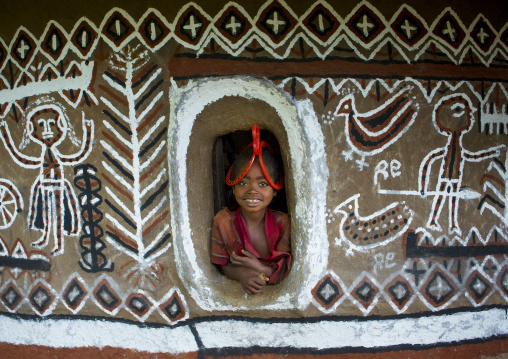 Girl With A Toothy Smile Posing At The Window Of A Decorated House, Adama, Omo Valley, Ethiopia