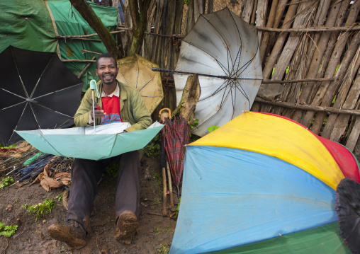 Man Seeling Umbrellas, Jemu, Omo Valley, Ethiopia
