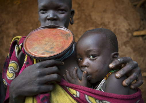 Suri Tribe Woman With A Lip Plate And Her Baby, Kibish, Omo Valley, Ethiopia